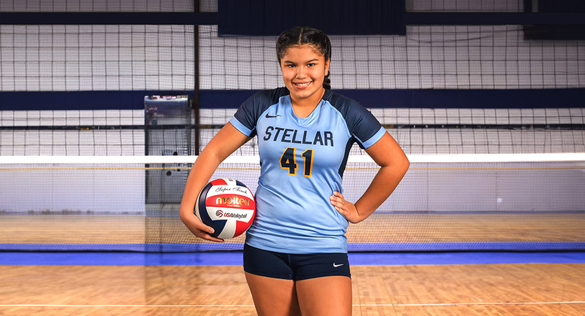 Gizelle posing for volleyball team