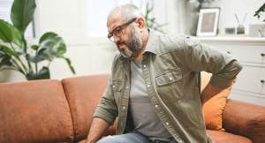 Mature adult man with back ache