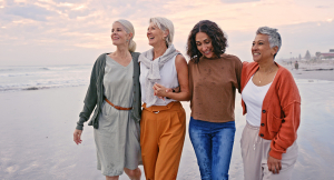 Group of mature women walking on a beach