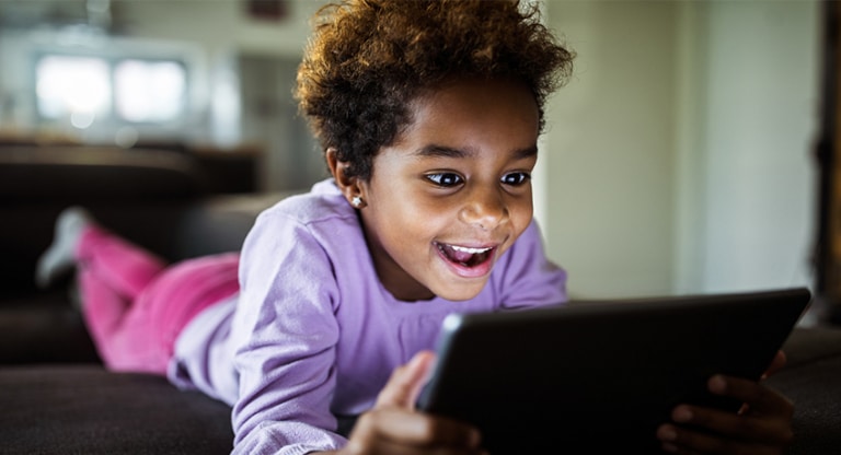 Child Playing on Tablet